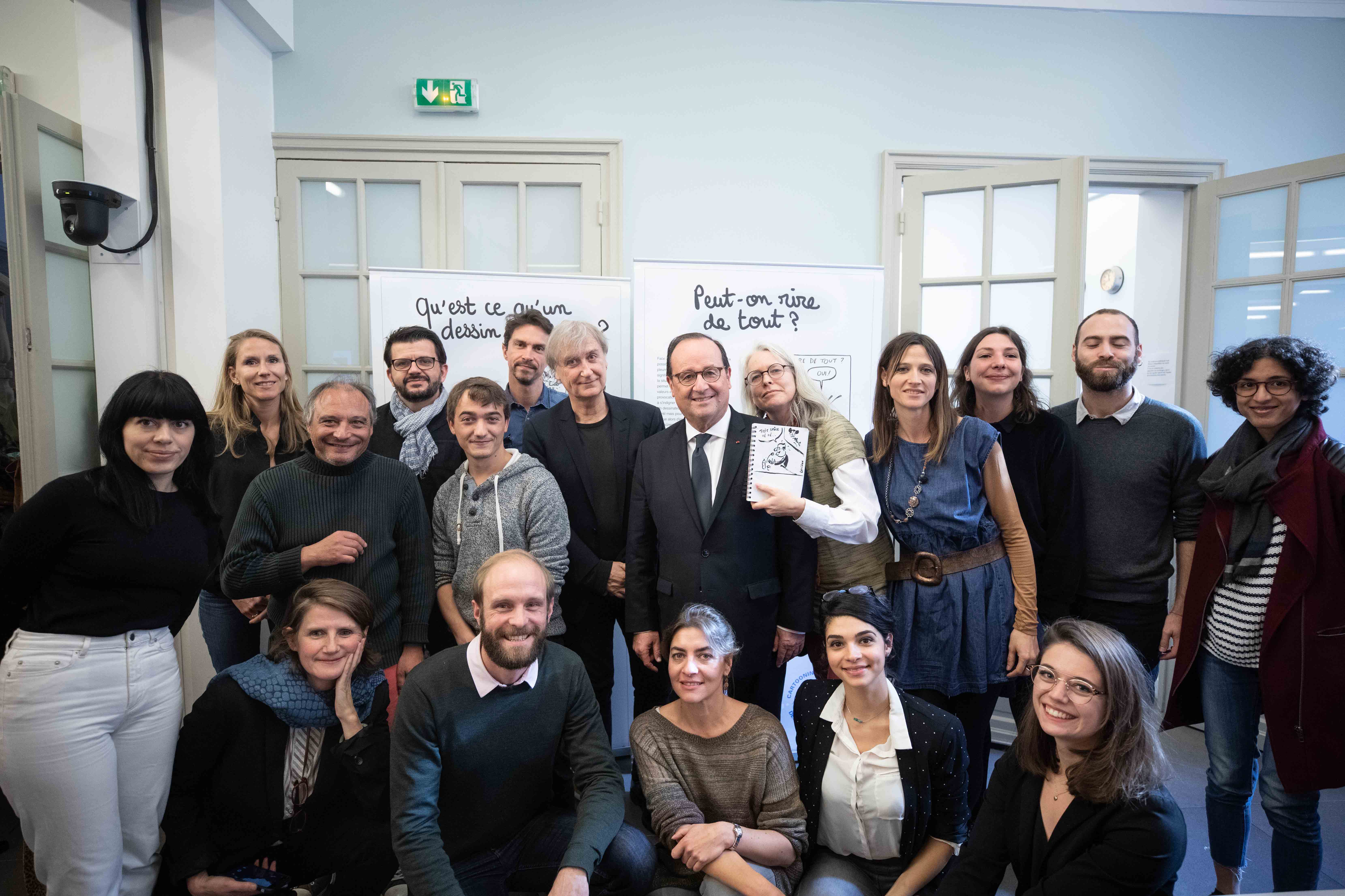 Cartooning for Peace team, cartoonists and François Hollande